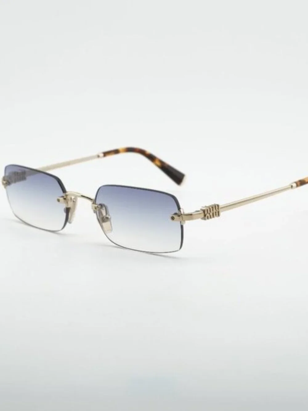 Miu Miu MUB50S ZVN80O Sunglasses Gold Rectangle Frame, Light Blue Lenses